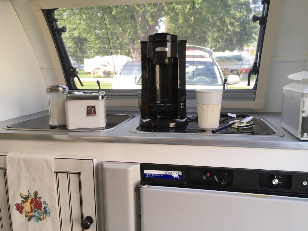 The T@bitha's kitchen has everything -- a sink, two-burner stove, and a three-way refrigerator. But all I needed to make my morning coffee was the sink and the overhead electrical socket.