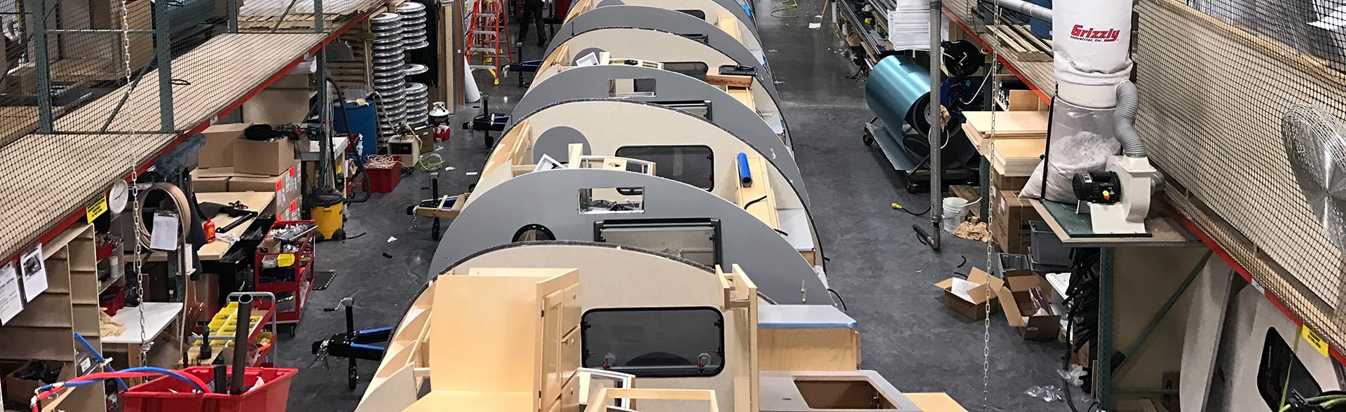 view of factory floor, teardrop trailers being built